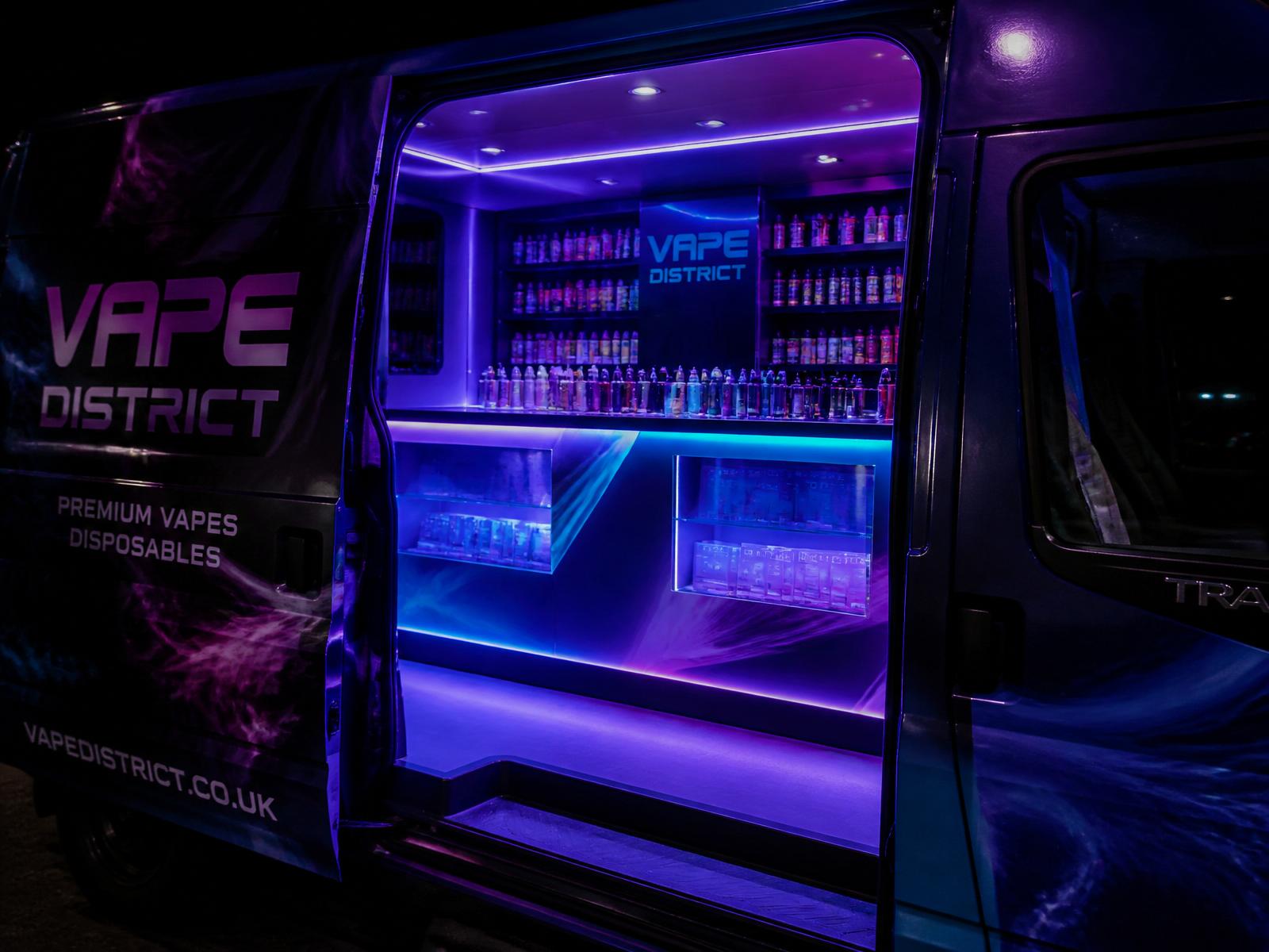 Interior of the Vape Van-Go Ford Transit with purple and blue LED lit display counter